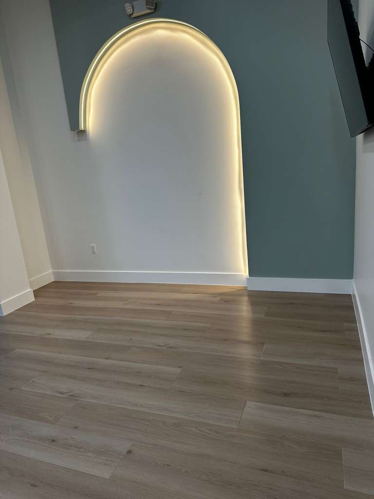 Freshly cleaned living room with wood flooring in a Southwest Florida home