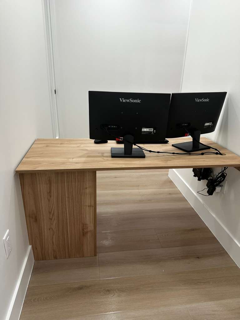 Tidy office workstation with dual monitors cleaned for a Southwest Florida business